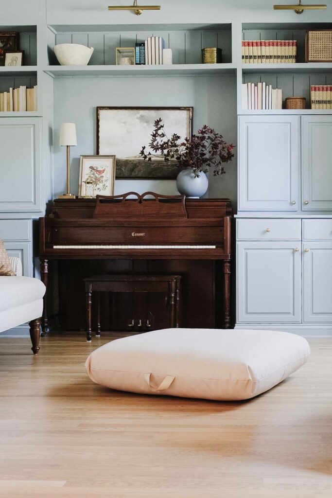 piano surrounded by cabinets painted in Sherwin William Debonair, blue