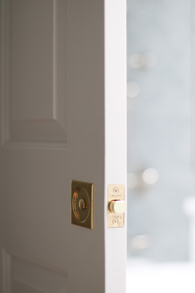 pocket door tubular hardware with rectangular plate in brass finish