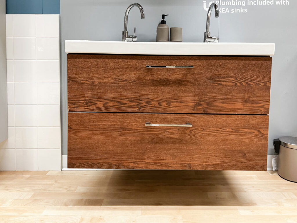 an in store display of the ikea godmorgon floating vanity in the walnut effect 