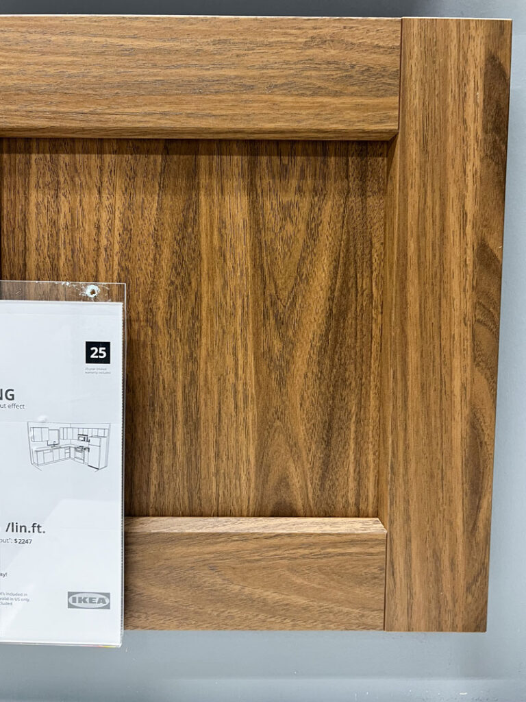 an in store display of the ikea enkoping walnut effect cabinet series door front