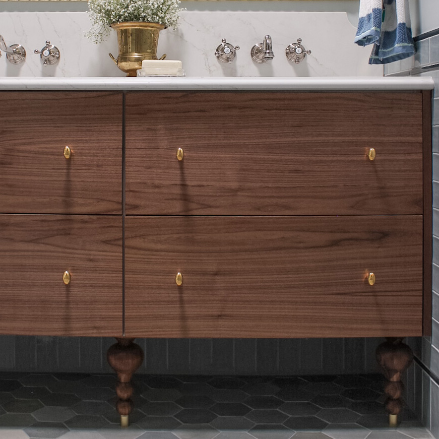 a walnut vanity with brass hardware 