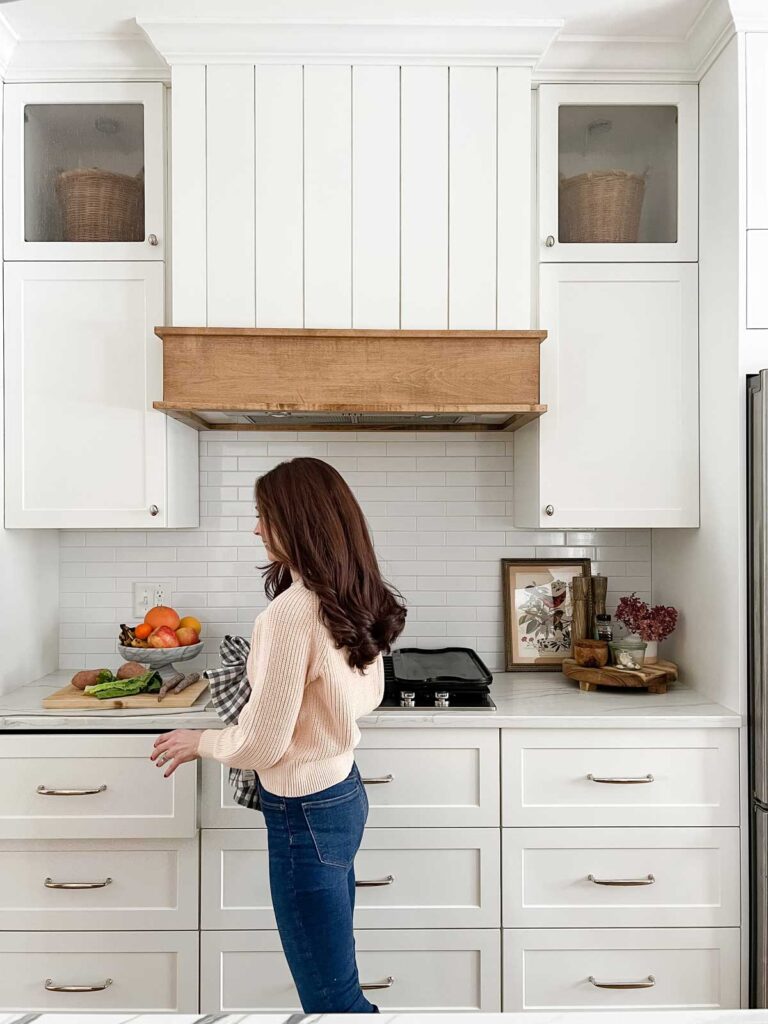 https://housewithhome.com/wp-content/uploads/2023/09/Ikea-Sektion-Cabinets-White-kitchen-with-vent-hood-768x1024.jpg