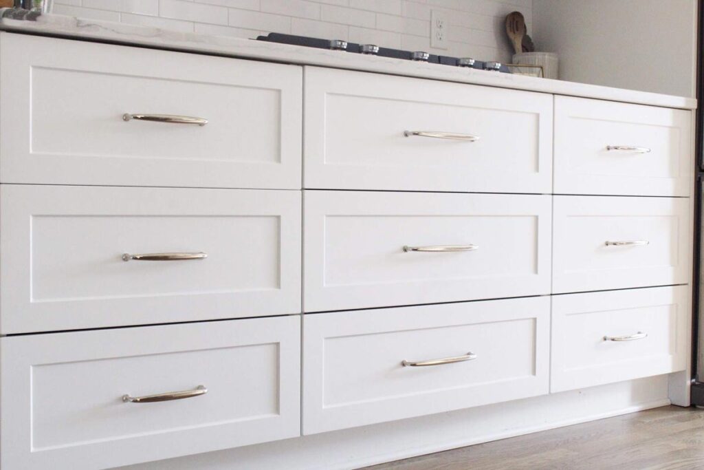 white cabinet doors with polished nickel handles